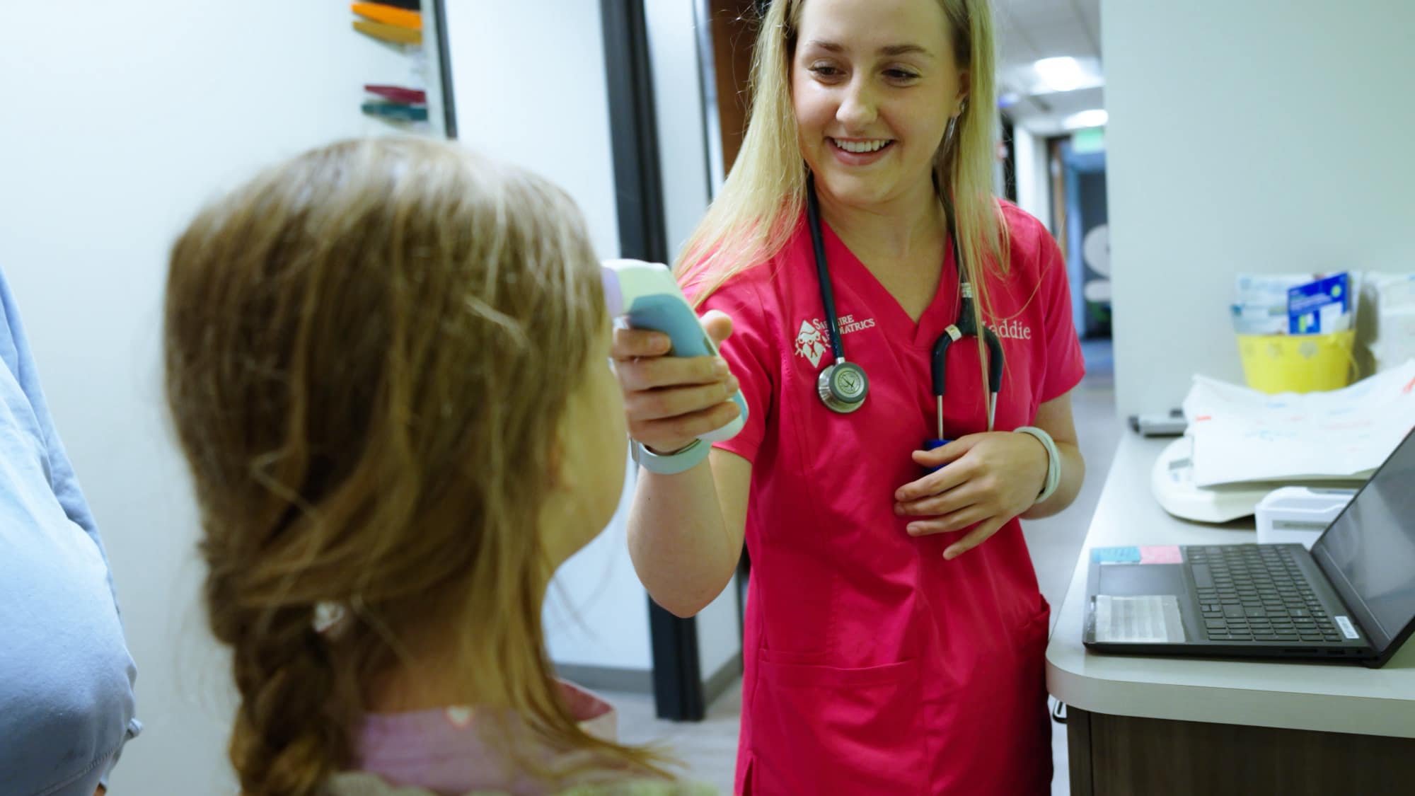 A Sapphire Pediatrics clinician caring for a child