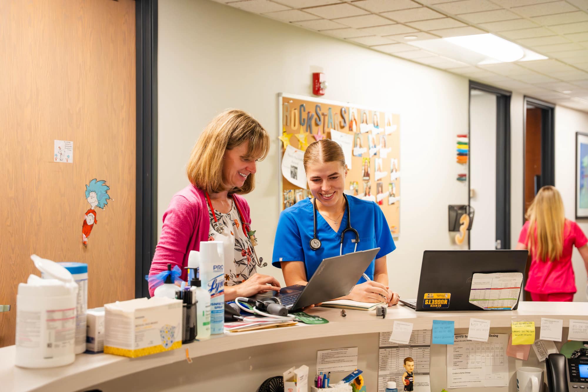 Sapphire Pediatrics team members working together at a clinical counter