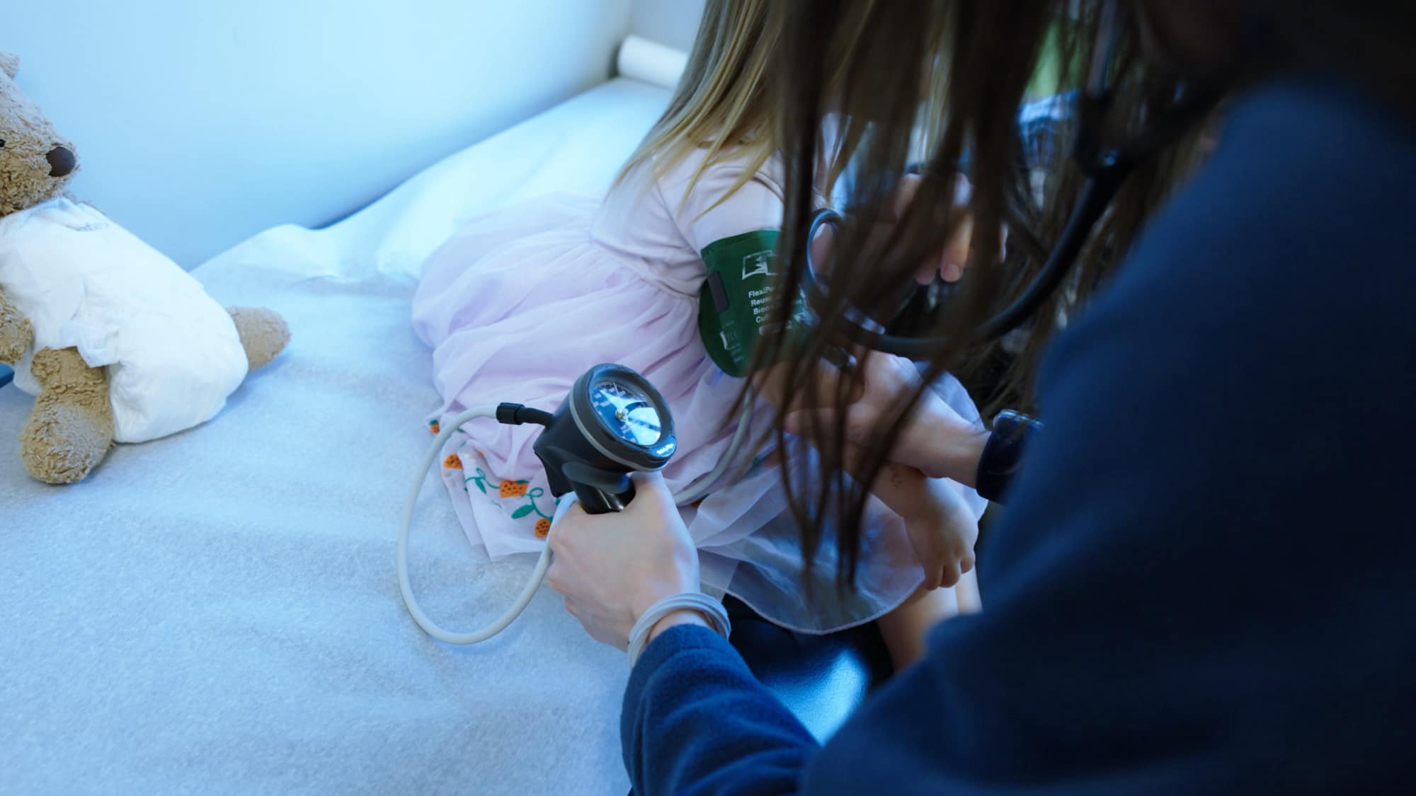 Care team member checking a child’s blood pressure